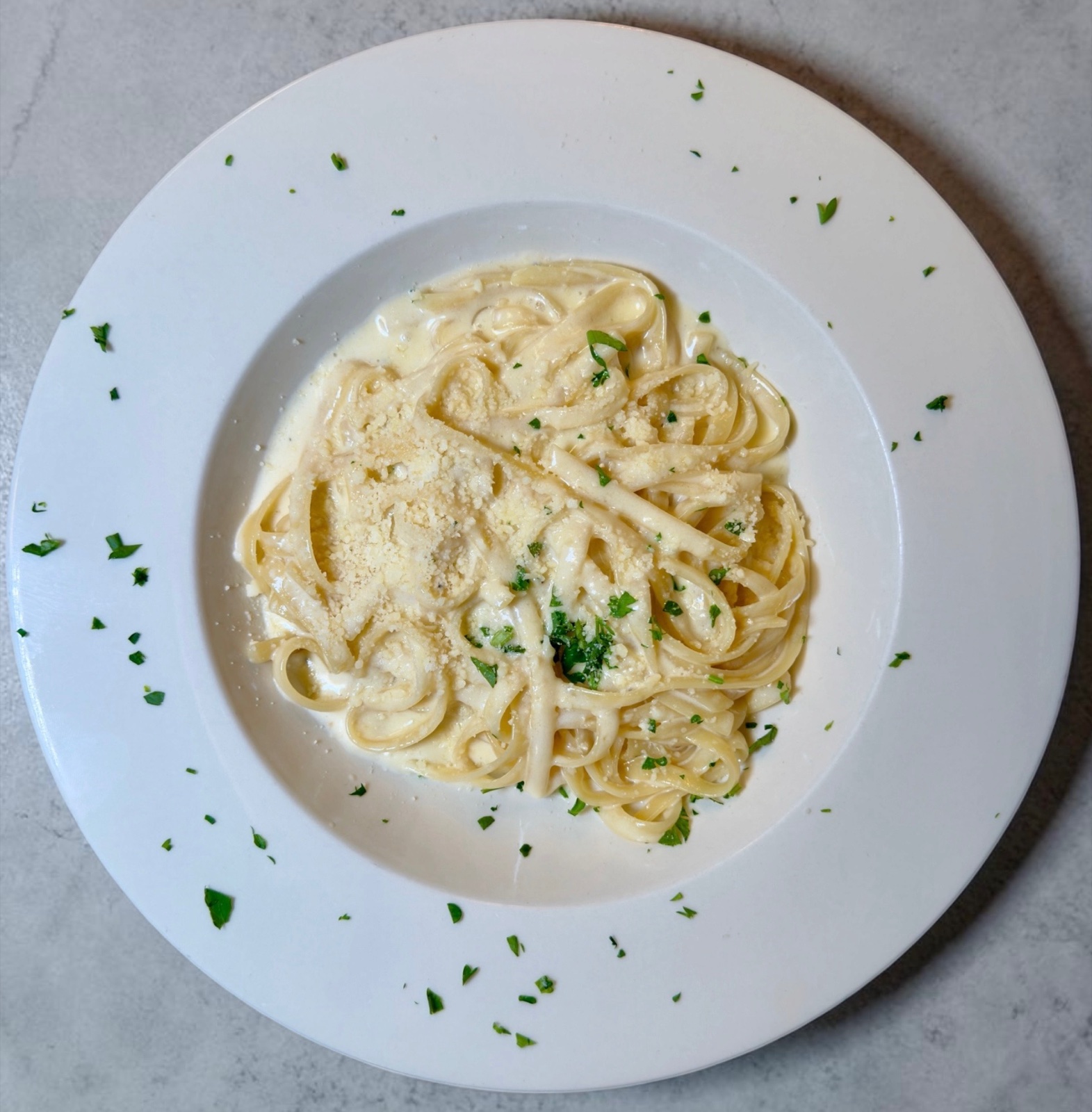 Fettucine Alfredo in creamy Parmigiano Reggiano sauce