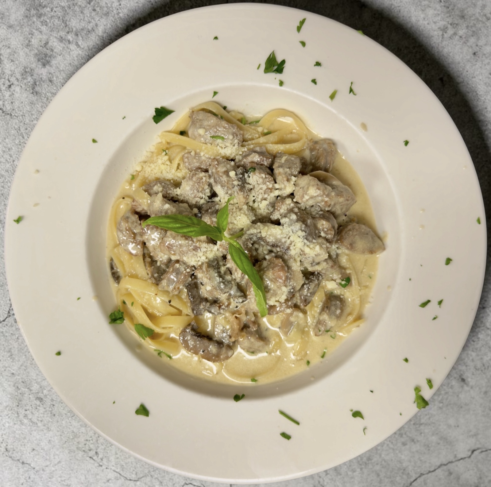 Fettuccine with sausage and mushrooms in cream sauce