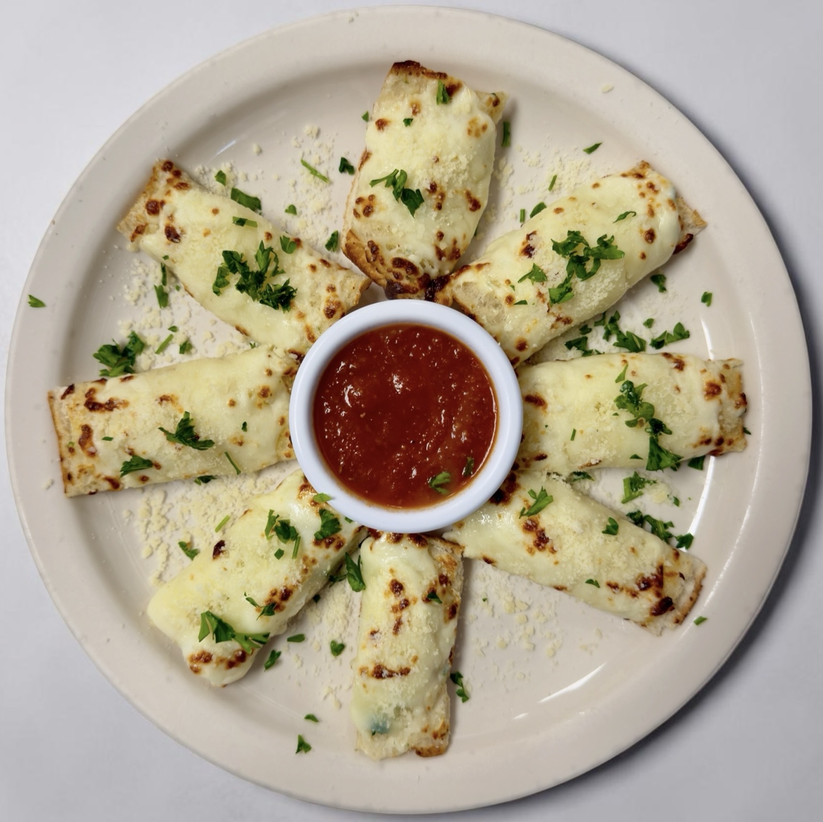 Homemade garlic bread served with marinara