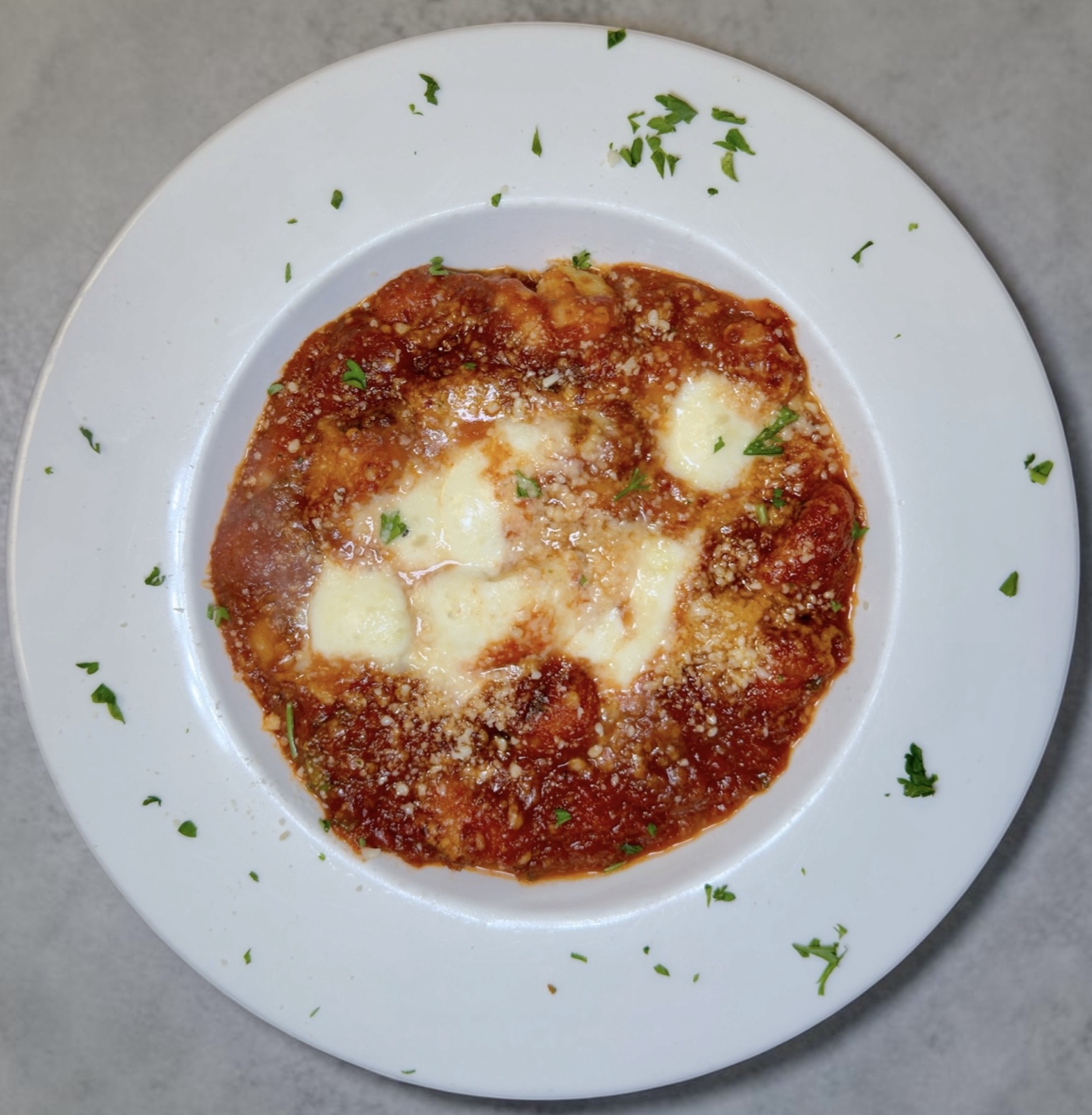 Gnocchi alla Sorrentina with marinara, mozzarella, and basil