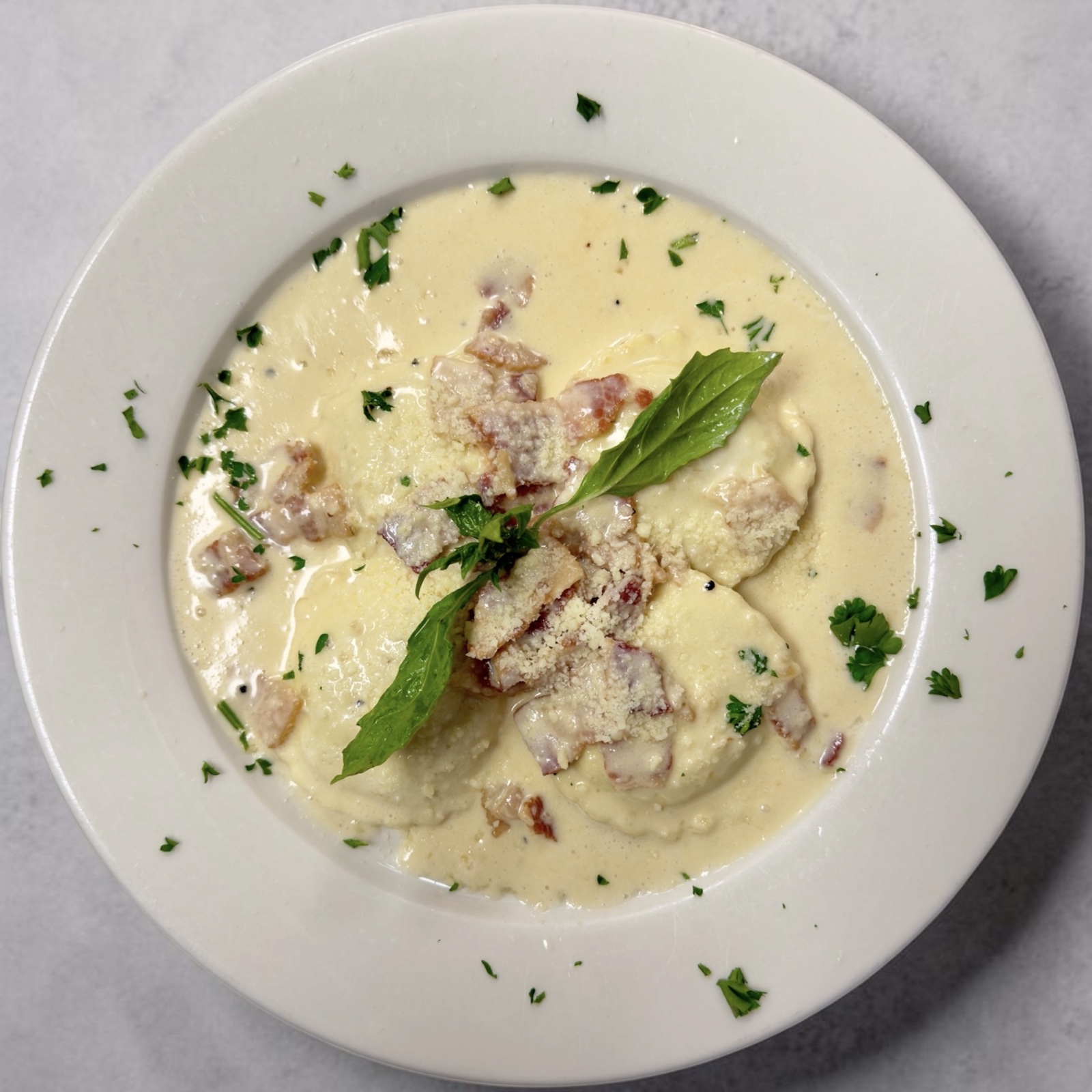 Mushroom ravioli in creamy amatriciana sauce