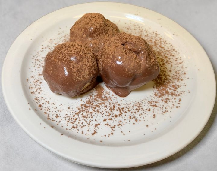 Sophia's profiteroles — cream puffs enrobed in chocolate