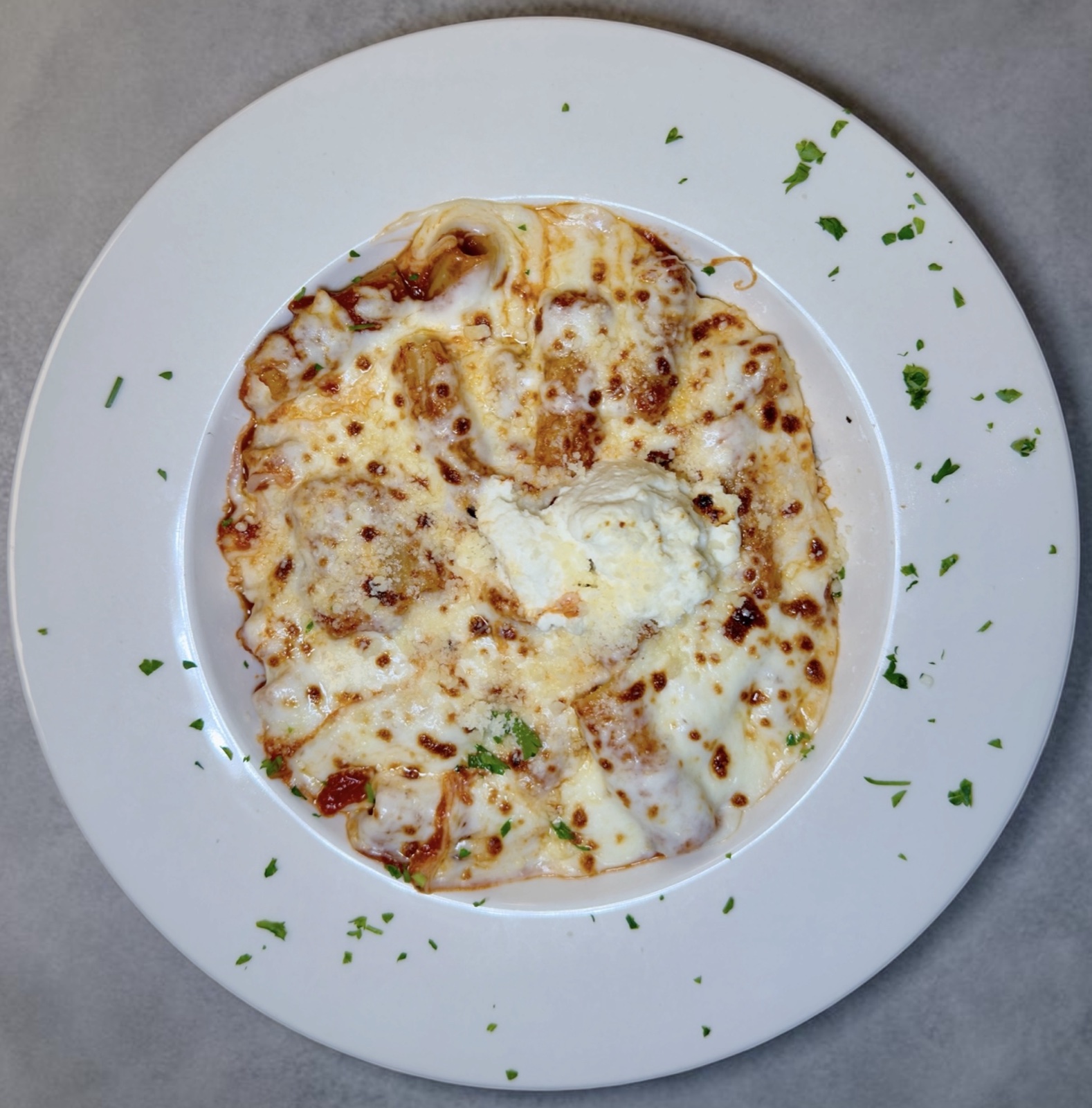 Baked rigatoni al forno with marinara, ricotta, and mozzarella