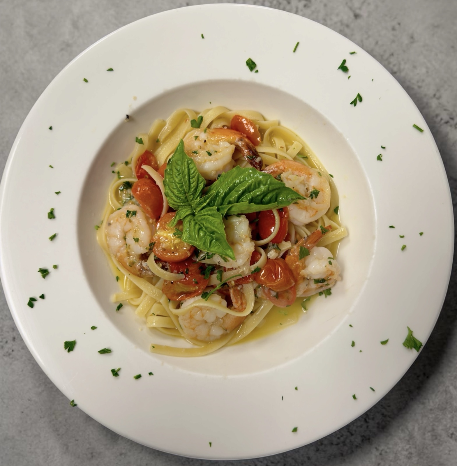 Shrimp scampi in garlic white wine sauce over fettuccine