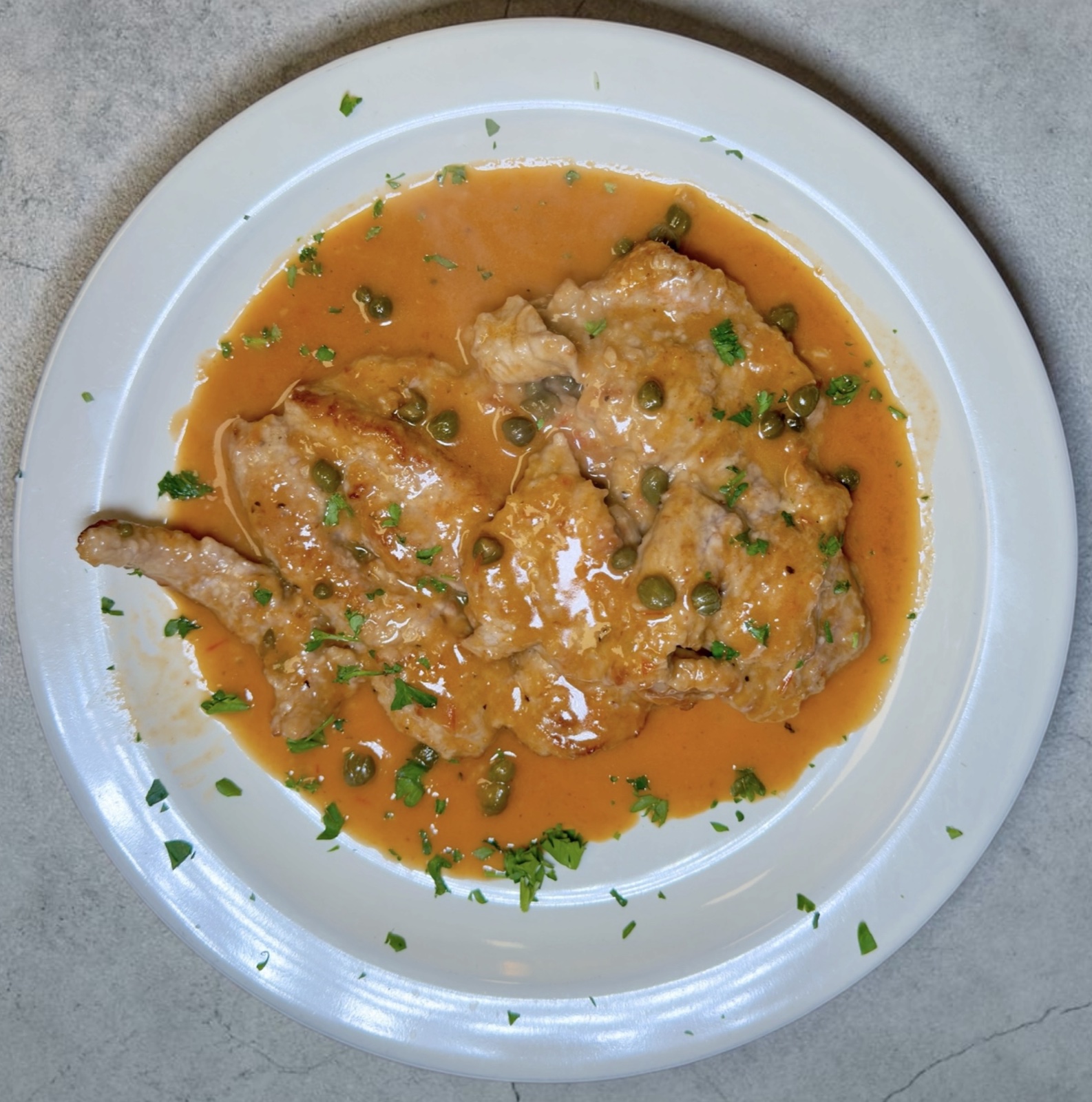 Veal piccata in lemon white wine caper sauce
